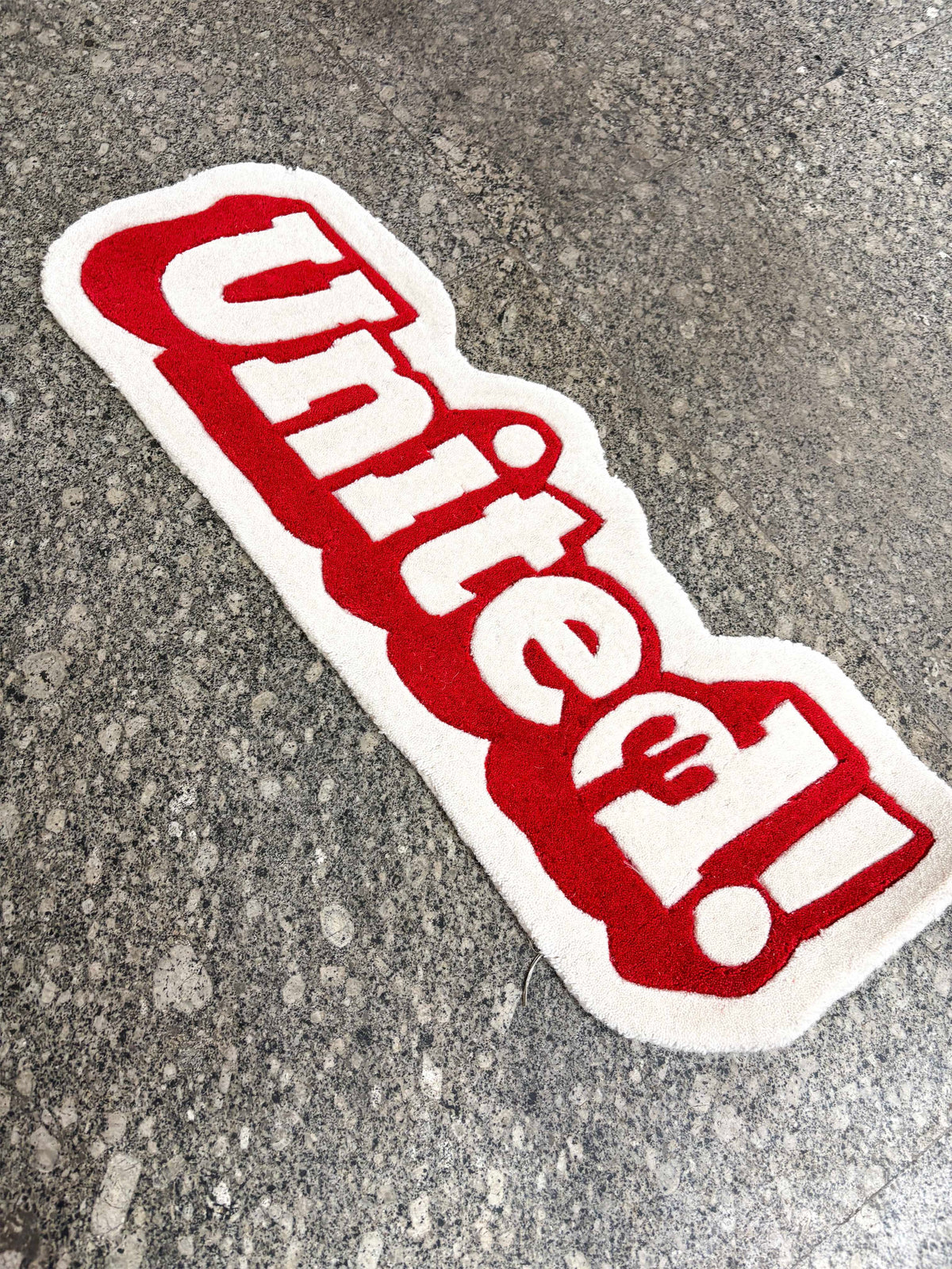 United fan art Hand Tufted Rug by THE DRIP CO. RUGS