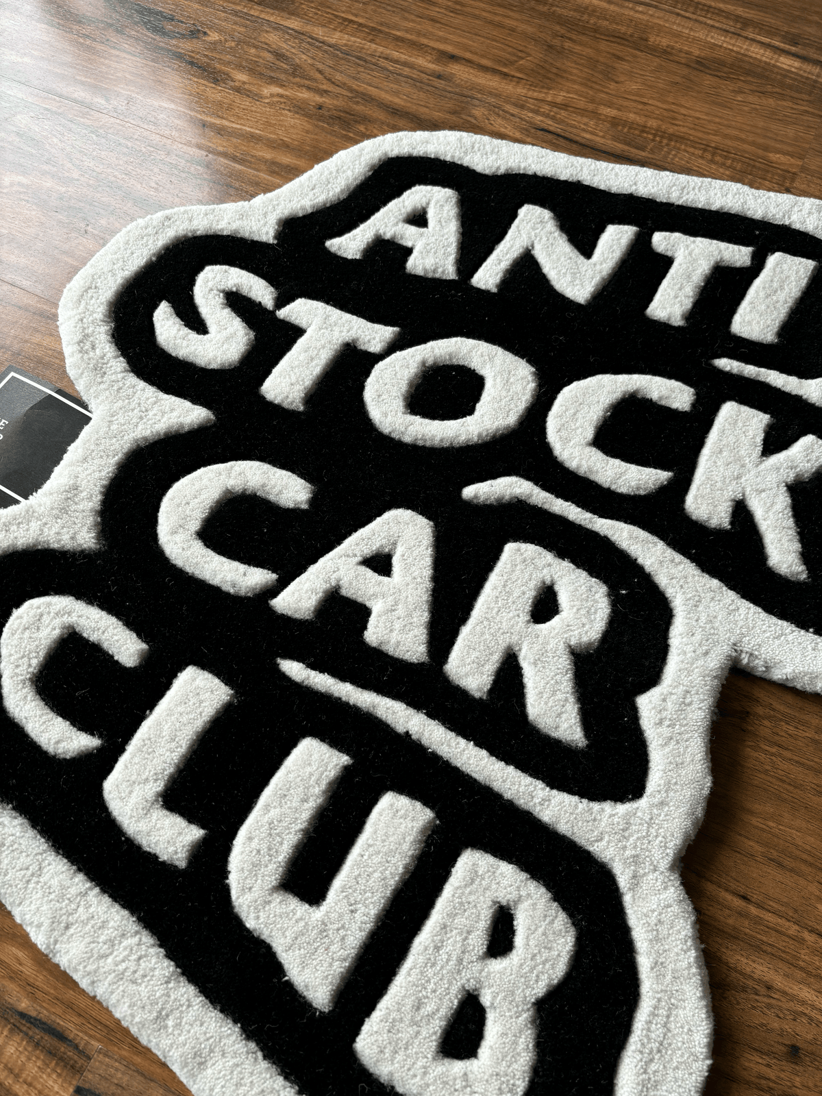 Anti Stock Car Club Hand Tufted Custom Rug by The Drip Co. by THE DRIP CO. RUGS