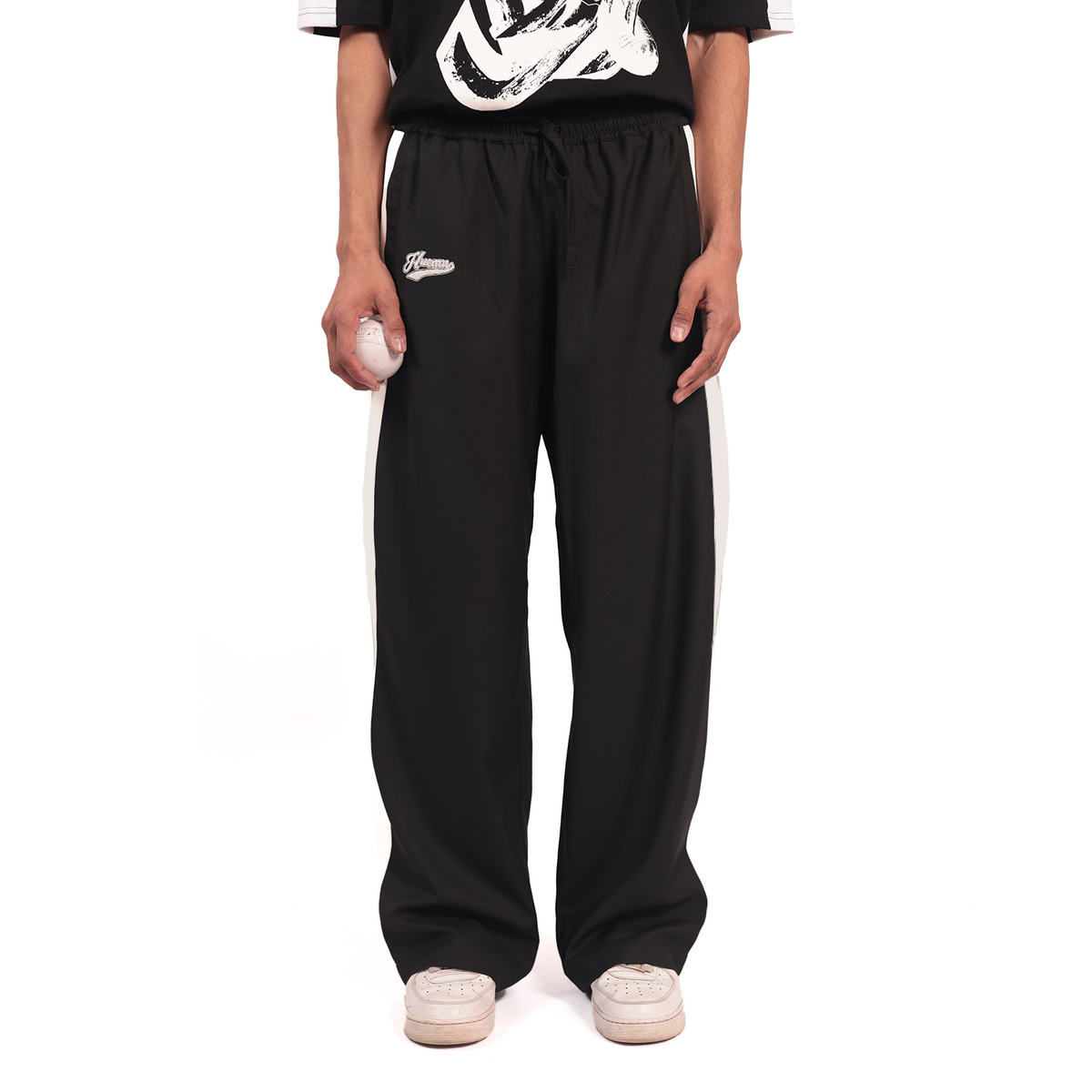 Shreyas Iyer x HUEMN embroidered trackpant with panelled detail (Black) by HUEMN