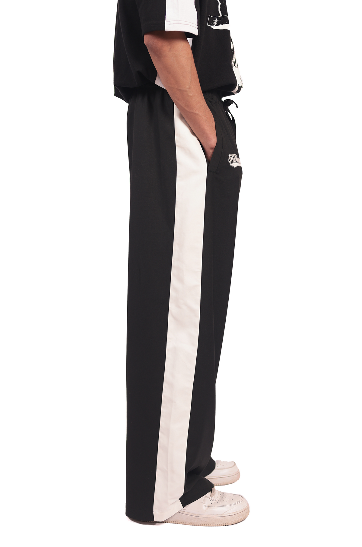 Shreyas Iyer x HUEMN embroidered trackpant with panelled detail (Black) by HUEMN