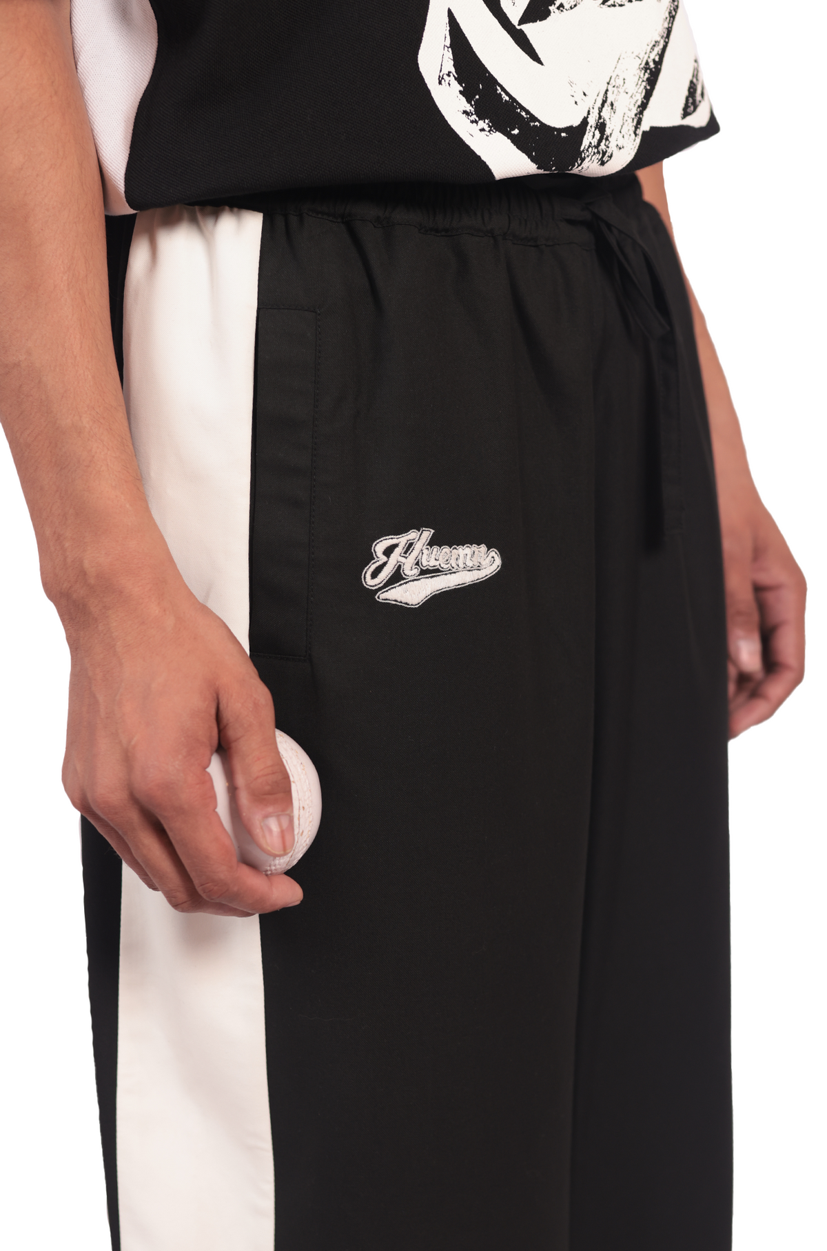 Shreyas Iyer x HUEMN embroidered trackpant with panelled detail (Black) by HUEMN