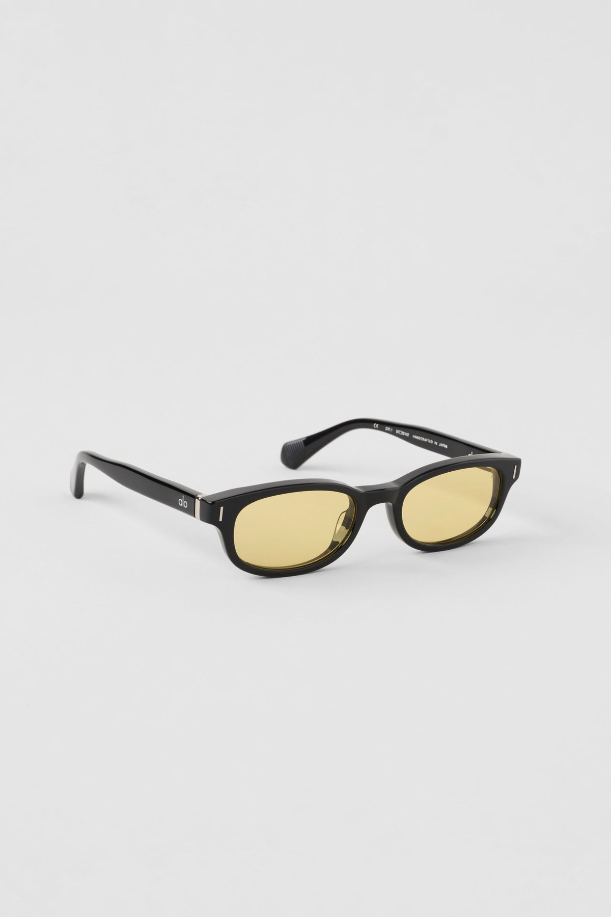 Alo Yoga Skinny Oval Sunglasses in Black/Yellow