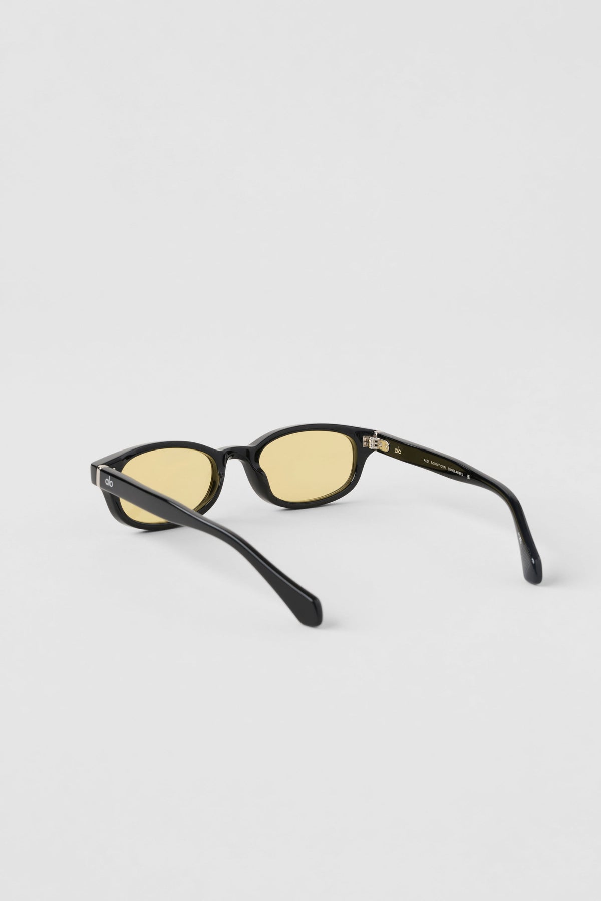 Alo Yoga Skinny Oval Sunglasses in Black/Yellow, product image 3 of 5