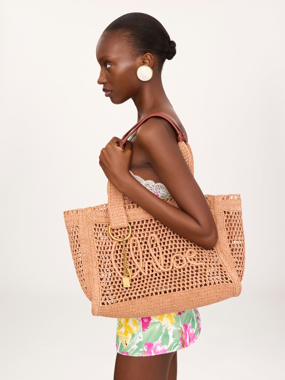 CHLOE Summer Banana east-west tote bag in raffia Summery Beige by CHLOE