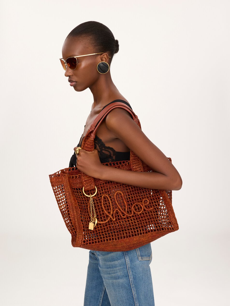 CHLOE Summer Banana east-west tote bag in raffia Clay Brown by CHLOE