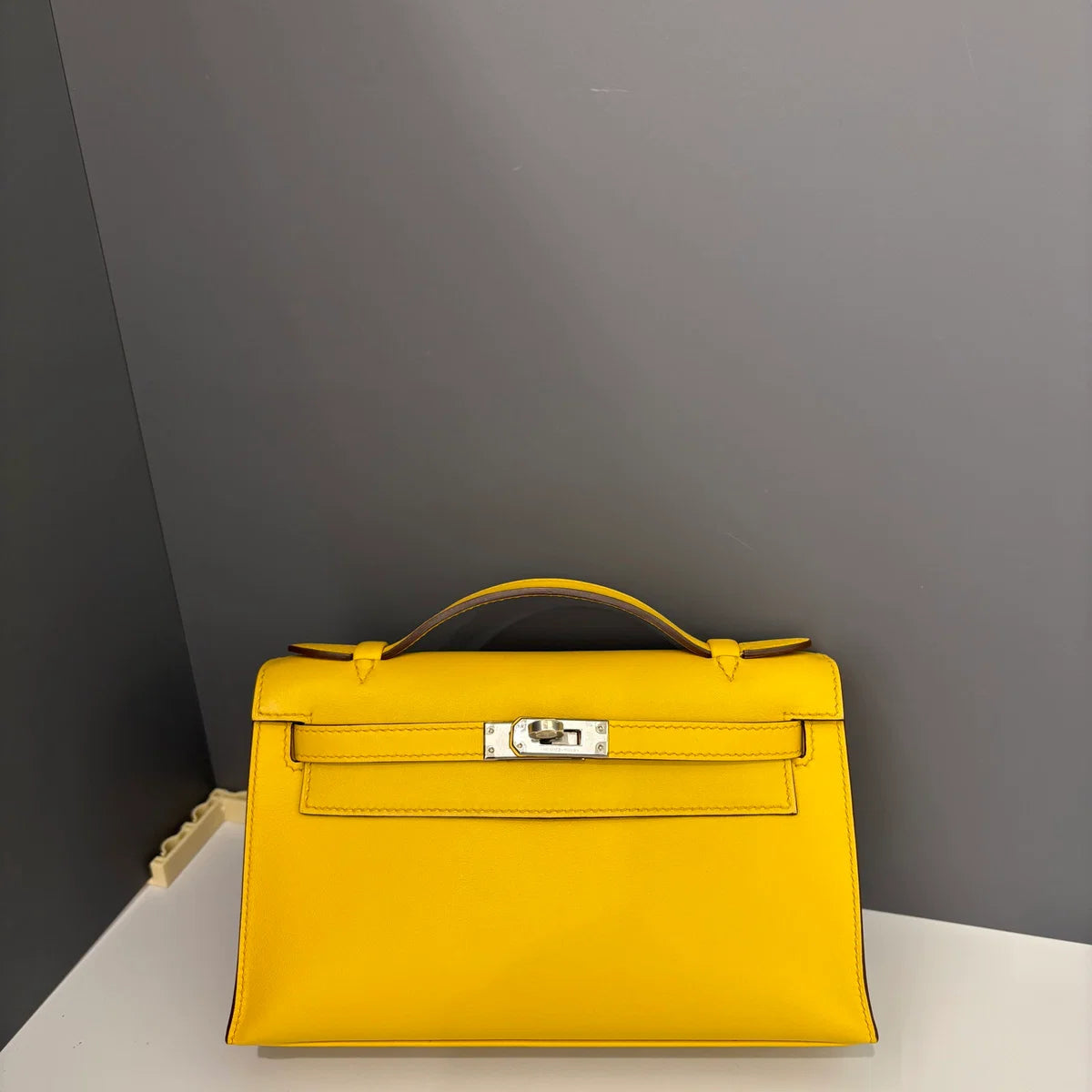 Hermès Kelly Pochette Swift 9D Jaune Amber