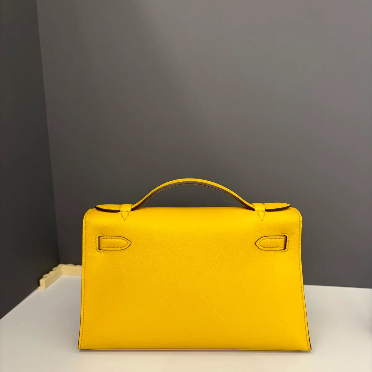 Hermès Kelly Pochette Swift 9D Jaune Amber