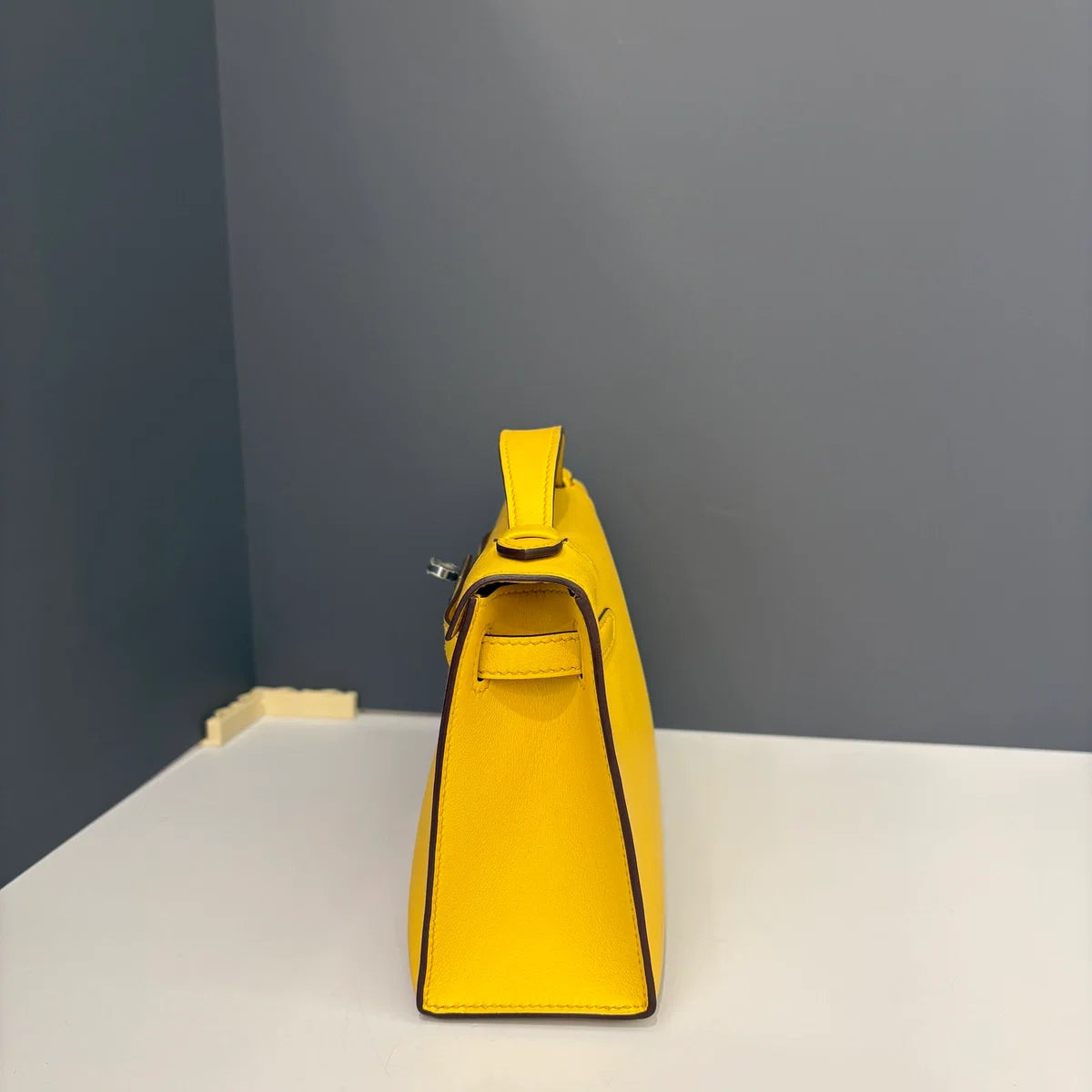 Hermès Kelly Pochette Swift 9D Jaune Amber