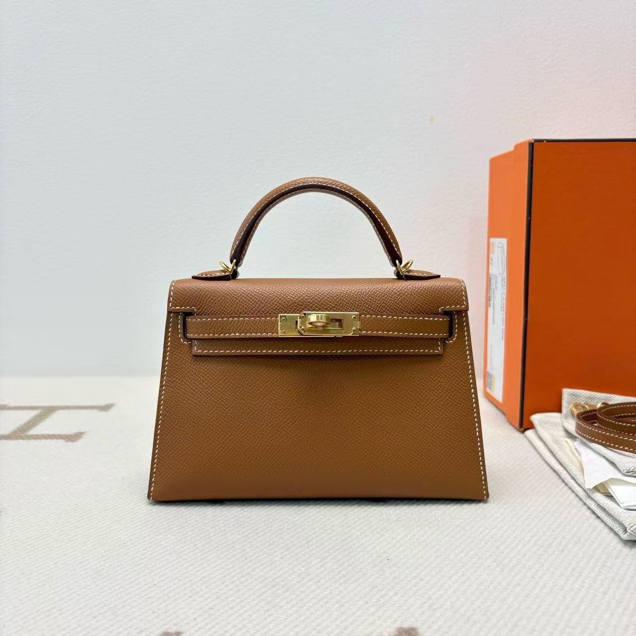 Brown top-handle bag with gold-tone hardware