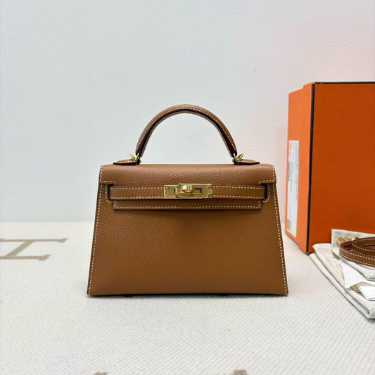 Brown top-handle bag with gold-tone hardware