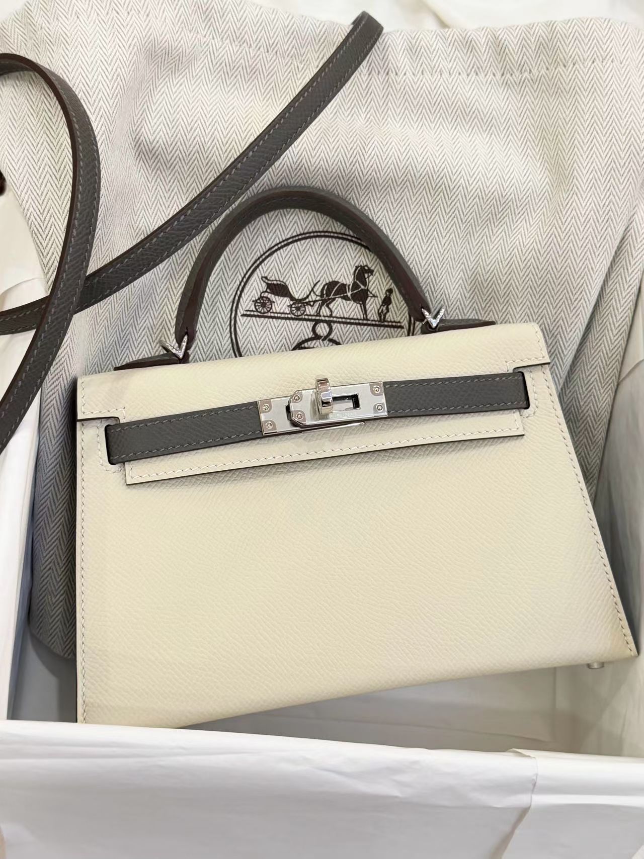 Cream and grey top-handle bag with silver-tone hardware