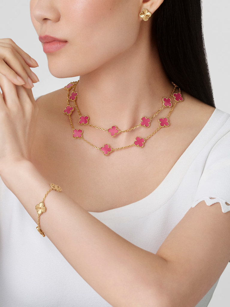 Vintage Alhambra long necklace, 20 motifs in pink enamel and 18K yellow gold, worn view