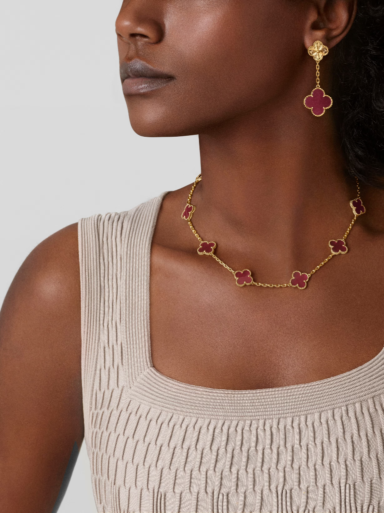 Vintage Alhambra necklace, 10 motifs in pink enamel and 18K yellow gold, worn view